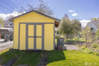 The garage housed the past owner's motorcycle and bicycles, and he would park his vehicle adjacent to it on the slab that is now fenced for a garden area.