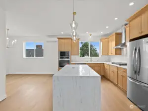 Gleaming quartz counters, stainless appliances and tons of cabinets and counterspace.