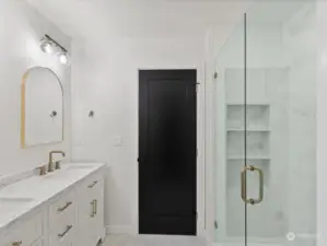 Built-in shelves in the primary shower.