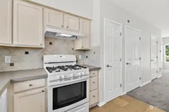 Kitchen with new Countertops, Refrigerator and Dishwasher. Tile back splash