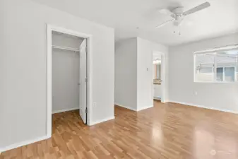 Primary Bedroom with view of walk-in closet and ensuite bathroom entry