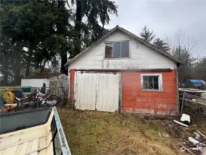 Outbuilding with sliding barn door