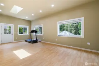 Bonus room attached to the garage. Possible mother-in-law suite or ADU with its own entry door. Not in the photo is the other wall with multiple closet space.