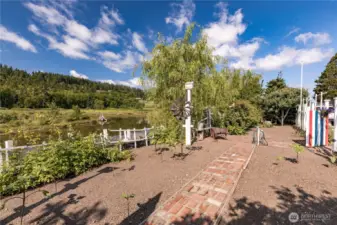 Beautiful space for vegetable garden.  Water on the lot and steps to the lower level and lagoon