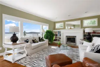 Open Living room with Owner designed fireplace and bookcases.  Lovely View windows.