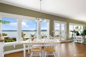 View windows stretch across the entire waterside to capture the breathtaking scenery.  French doors create more connection with the outside.  Deck has built in BBQ bib