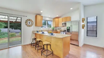 Extend your living and dining space for the covered patio in this private and fully-fenced backyard.
