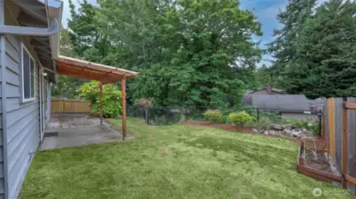 Fully-fenced and level backyard offers the perfect space to garden, for activities, entertaining and so much more!