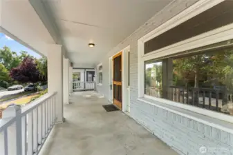 The expansive covered porch is ready for your rocking chairs!