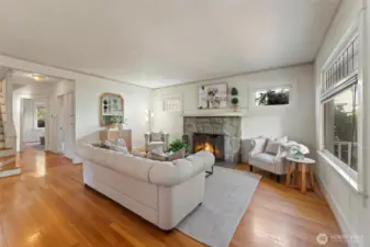 Inside the front door, you'll enter into the large living room with a statement woodburning fireplace