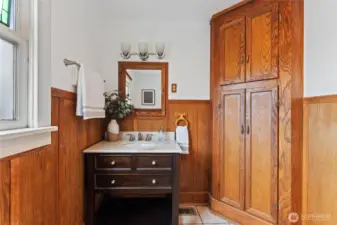 While being refreshed, the bathroom still features the classic wood paneling.