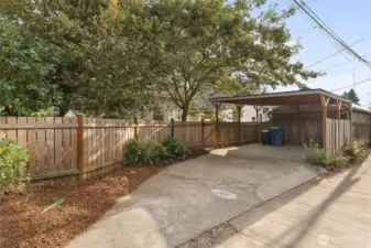 Covered carport, along with alley access.