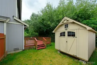 Large shed in backyard stays for more storage.