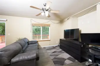 Family room off the dining room with laminate flooring.