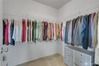 Primary bedroom walk in closet.