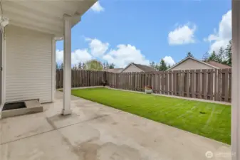 Covered Back patio with fresh sod