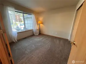 On the main floor off the foyer is a 5th bedroom/office/den (you decided how to use it) with the water fountain outside the window.