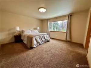 Master Bedroom overlooks the backyard an beautiful sunsets can be viewed from the large window.