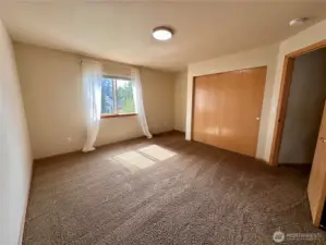 The largest of the secondary bedrooms with views of the backyard.