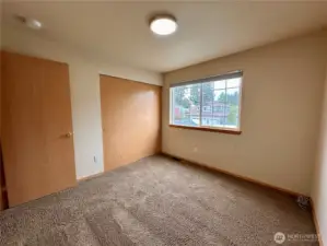 Secondary bedroom on the front side of the house nearest the stairs.