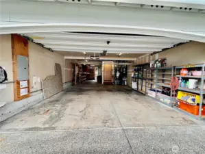 Tandem 3 car garage.  The back bay is currently configured as a workshop with a back door that goes out to the backyard.