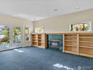 Living room with gas fireplace and access to the deck