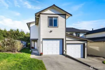 Fresh exterior paint (2024), new roof (2023), and well-kept landscaping create a welcoming first impression.