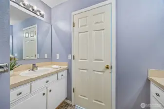 Ample storage and a clean coastal palette make this bathroom both practical and refined.