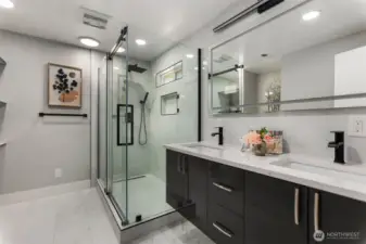 Primary bedroom with ensuite bathroom features a double vanity and large shower for all your needs!