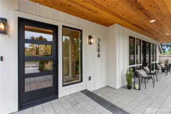 Covered tile-paved porch perfect for morning coffee or evening unwinding