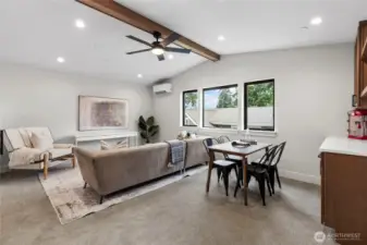 This entertainment room with a built-in bar offers the perfect setting for hosting and relaxing, blending casual comfort with modern style. The open layout, warm lighting, and multifunctional design make it ideal for gatherings, game nights, or unwinding with a drink in hand.