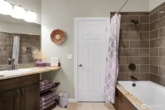 A spa-like bath connected to the 2nd primary bedroom and hallway is designed for slow mornings and peaceful evenings.