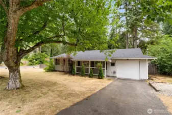 Nestled on a shy, half acre fenced corner lot - there's room for your RV, potential for a shop, garden space & room to roam & play