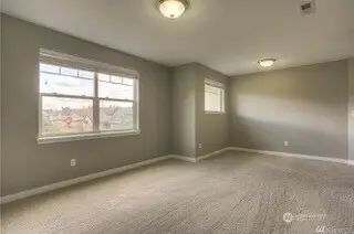 This bonus room is ready for whatever you throw at it. With tons of space, plush carpeting, and two large windows bringing in the natural light, it’s perfect for a multigenerational living setup with studio-style vibes. Or transform it into a second-story gathering area, game nights, crafting, or just relaxing together. The wide slat blinds give you the option for privacy when needed. Whether it’s a playroom, office, or cozy retreat, this space can truly be whatever you want it to be.