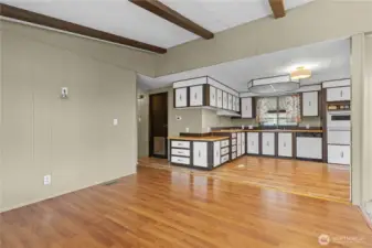 Antother view of seating/tv room and kitchen.