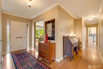 The formal entrance opens to an inviting foyer with hardwood floor.