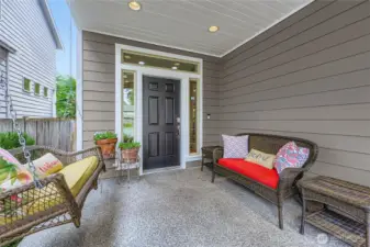Covered front porch with aggregate walkway. You may want to sit awhile on your way to the front door!