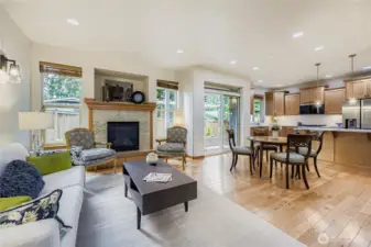 Hardwood floors grace the entire main floor.  Living Room, Dining Room and Kitchen enjoy an open floor plan and recess lighting in addition to sconces for softer evening light.