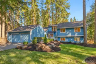 NW contemporary tri-level in landscaped 0.9 acre