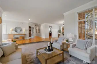 This view is looking from the living room toward to foyer straight ahead & the formal dining room to the right.