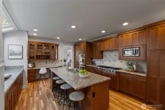 This kitchen has solid wood cabinetry, granite countertops, and also has a work station for homework, or to keep everything in order!