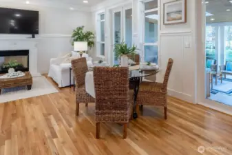 Lovely eating area between the kitchen and family room! To the right is access to the sunroom through double French Doors.