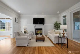 The kitchen flows seamlessly into the family room. The hardwood floors shine, the paint is brand new and the gas fireplace offers warmth on a cool evening.