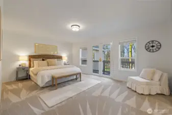 The large primary suite has it's own private deck with a view of the backyard.