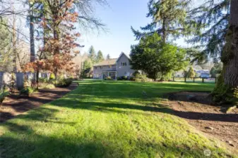 Beautiful mature landscaping and fully fenced parklike back yard!