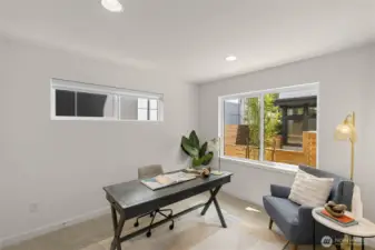 Additional bedroom offers natural light and comfort for guests or a quiet workspace.