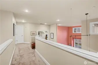 Airy upstairs landing overlooks the level below enhances the home’s light, open feel.