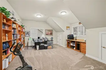 Large bonus room upstairs provides the perfect space for play, media, or relaxation.