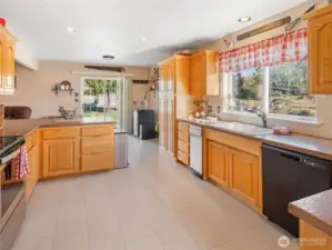 Kitchen with new flooring and new dishwasher.