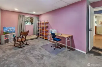 Versatile office or flex space with endless possibilities—perfect for working from home, hobbies, a playroom, or even a cozy movie spot. Fresh carpet, built-in shelving, and great natural light make it both functional and inviting!